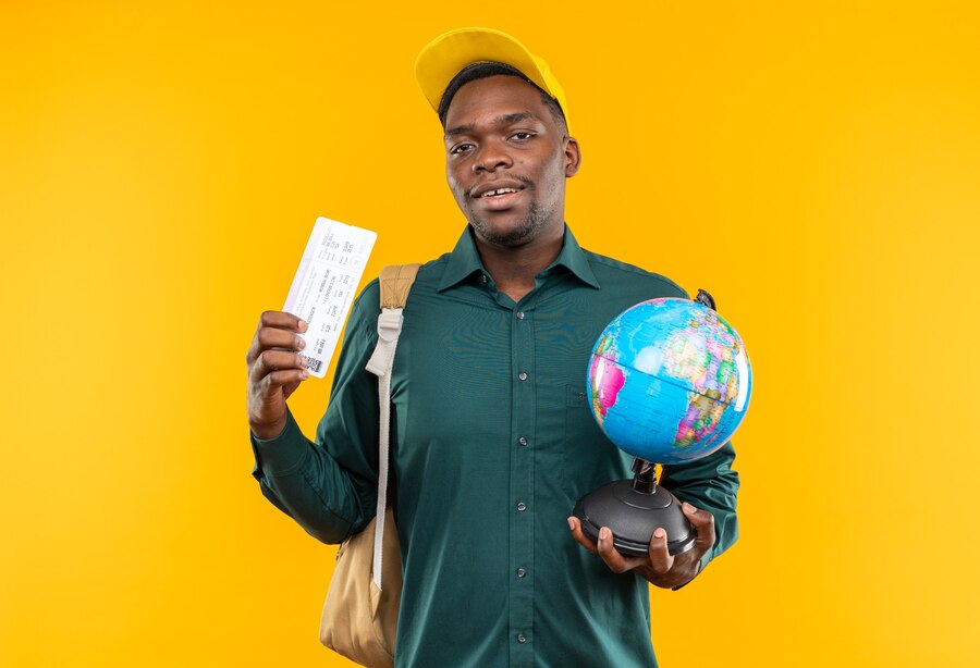 Sustainable Travel Destinations image, with a man wearing blue shirt and holding VISA card